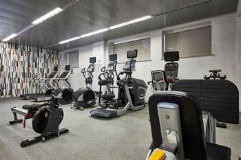 Fitness center with smartphone connectivity and individual LCD screen technology